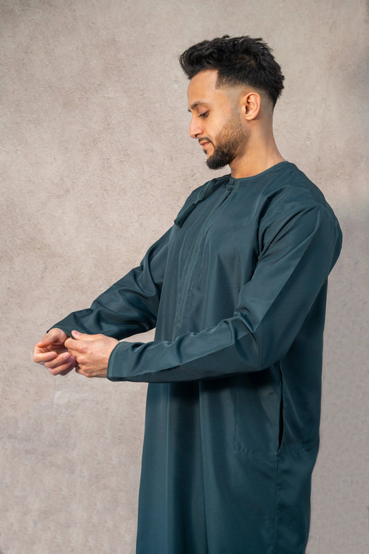 Detailed front view of teal blue Omani thobe / jubba showcasing the quality