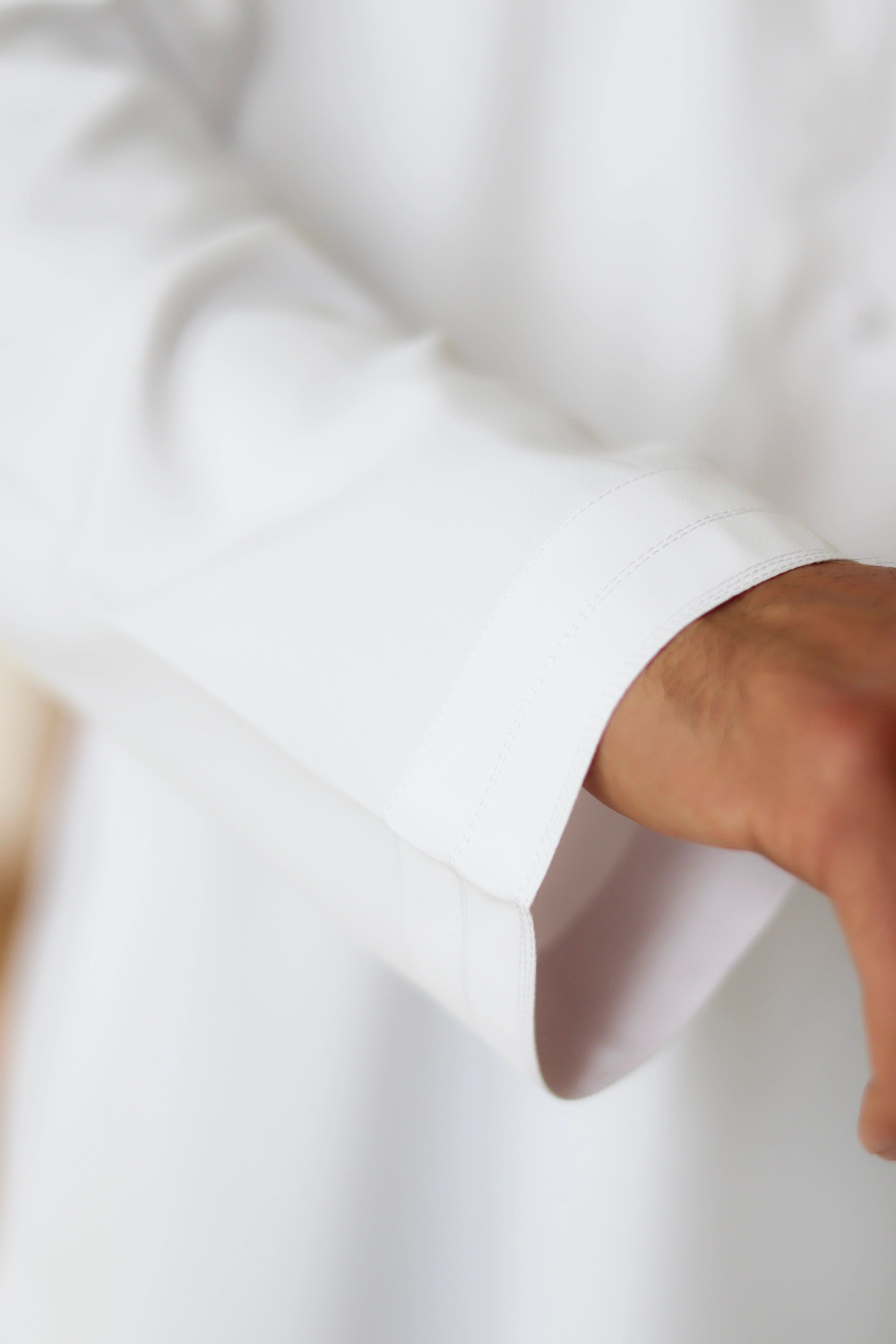 Close of up White Emirati Thobe sleeve detail