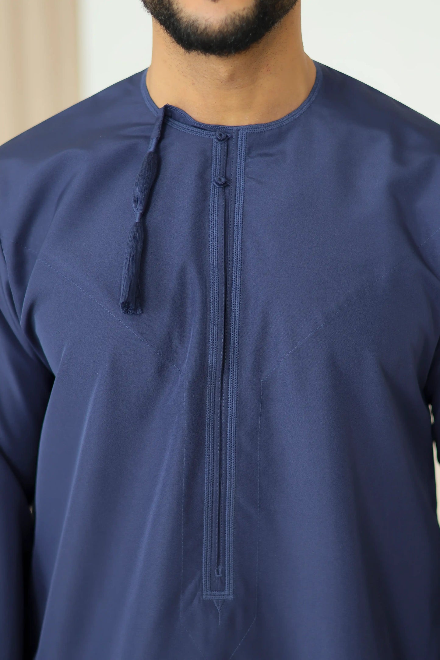 Navy Omani thobe tassel and embroidery detail – Qalbi