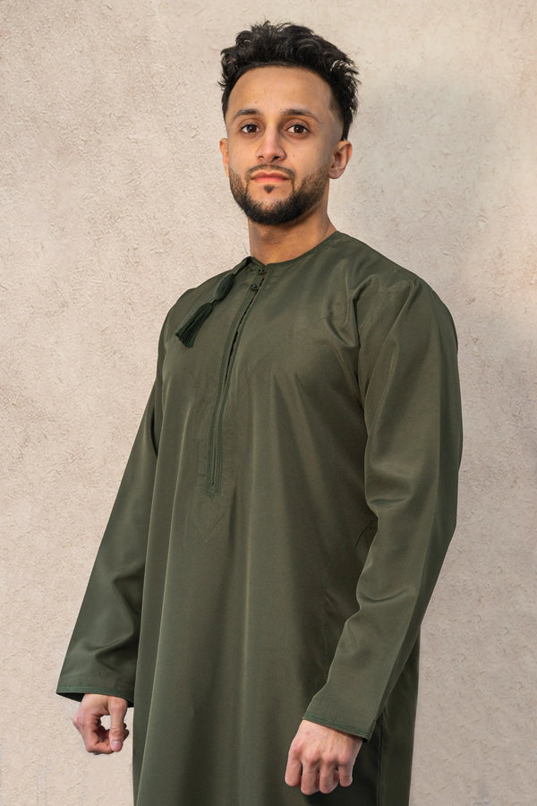Model wearing handcrafted Omani Thobe Jubba in Forest Green – Qalbi Thobes UK